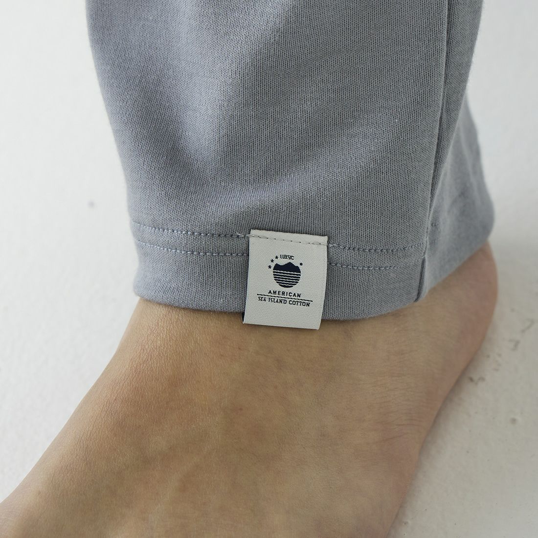 ポカ ウォモ アメリカンシーアイランドコットン前閉ロングテーパードパンツ