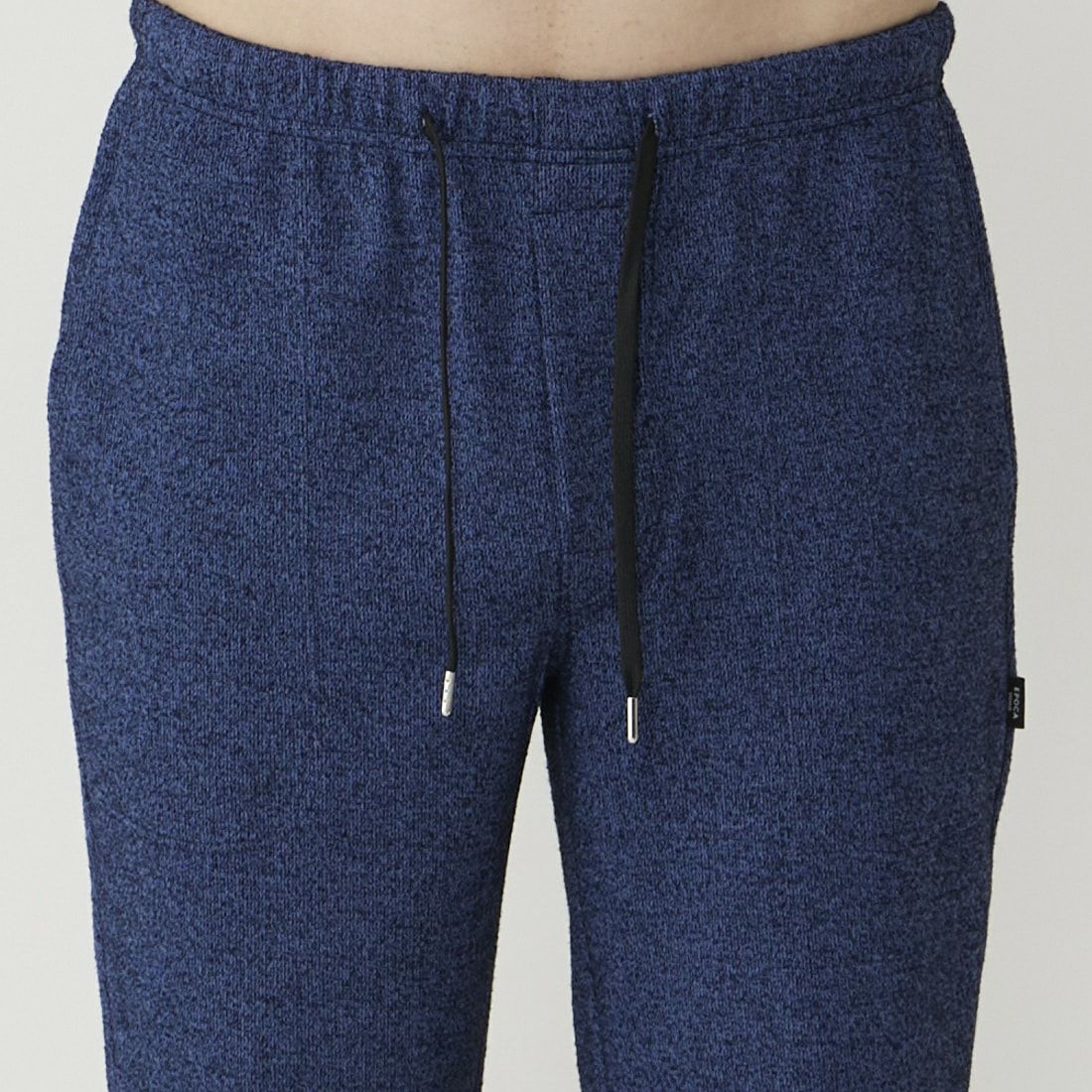 エポカ ウォモ 前開きロングリブテーパードパンツ