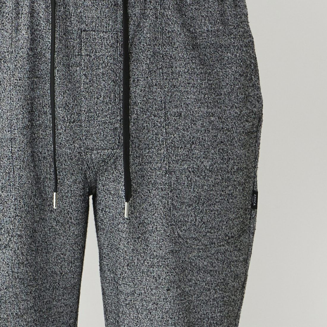 エポカ ウォモ 前開きロングリブテーパードパンツ