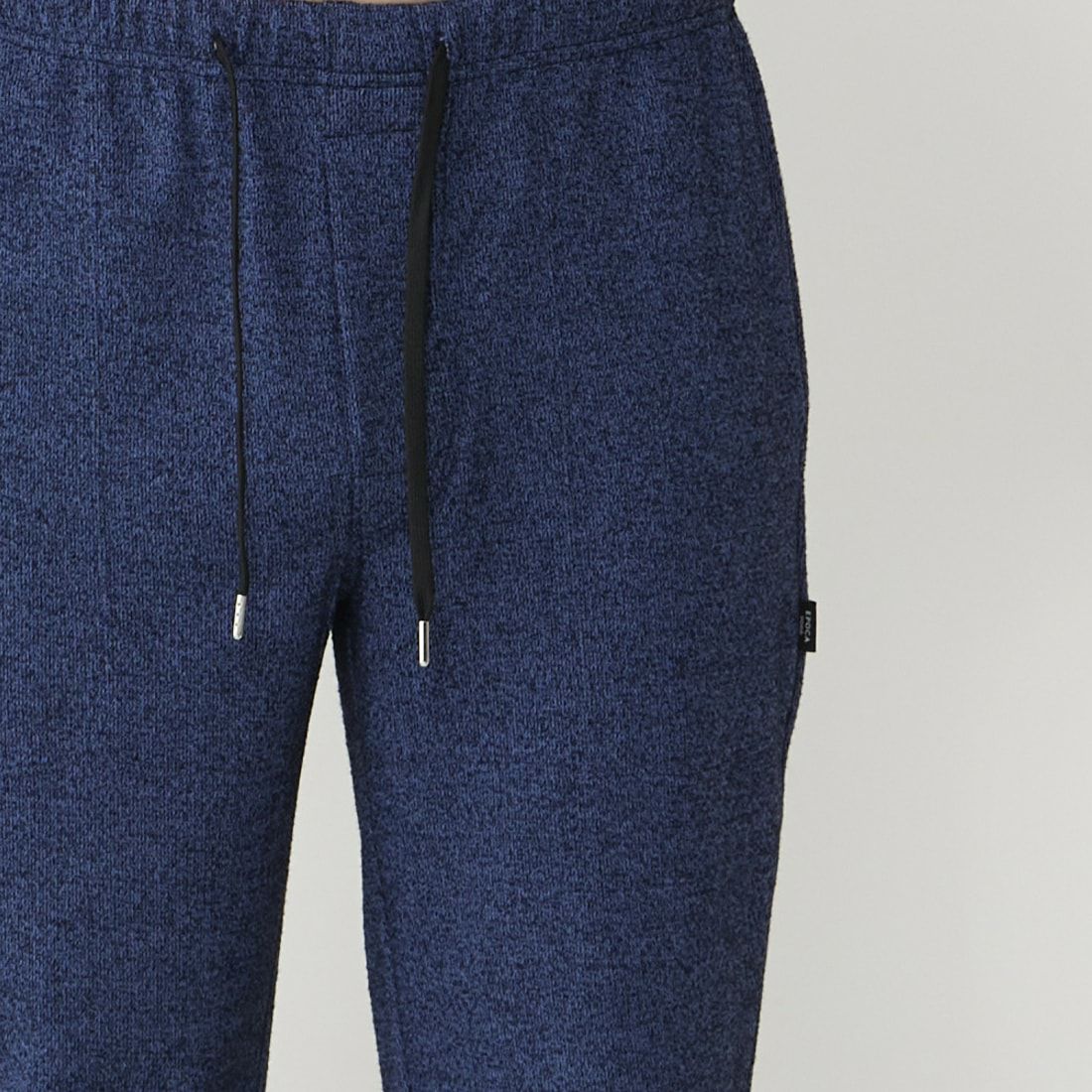 エポカ ウォモ 前開きロングリブテーパードパンツ